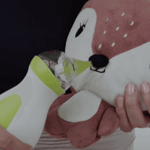 Demonstration of the use of the Nosiboo Go Portable Nasal Aspirator on a plush toy.