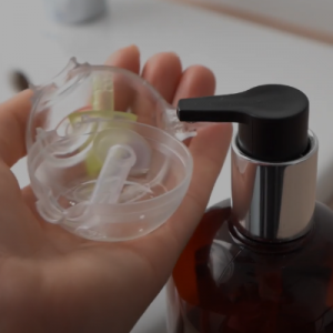 A woman cleaning the parts of the Colibri head.